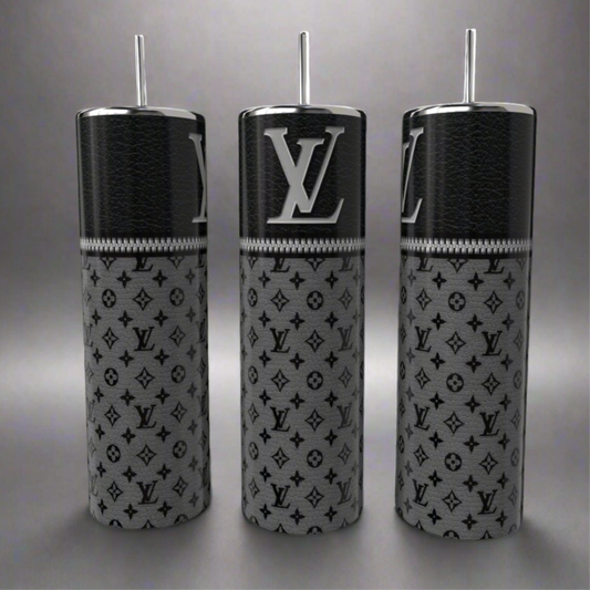 Three Louis V 20oz Skinny Tumblers by Kreative Kreationz, featuring a sleek black upper texture with gray "LV" logo patterns, elegantly stand on a reflective gray surface. These eco-friendly luxury cylindrical bottles with straws blend style and sustainability seamlessly.