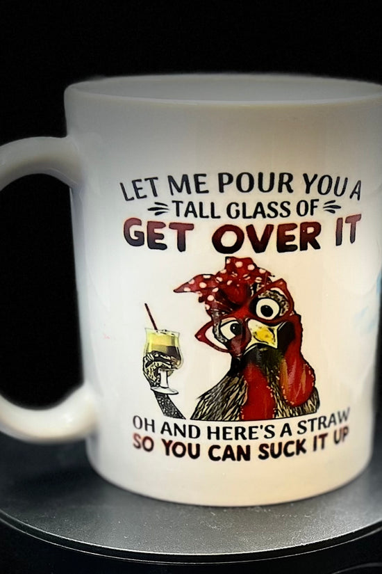 The Chicken Ceramic Mug by Kreative Kreationz features an adorable illustration of a chicken wearing a red bandana and glasses, holding a yellow drink and straw. The text humorously reads, 