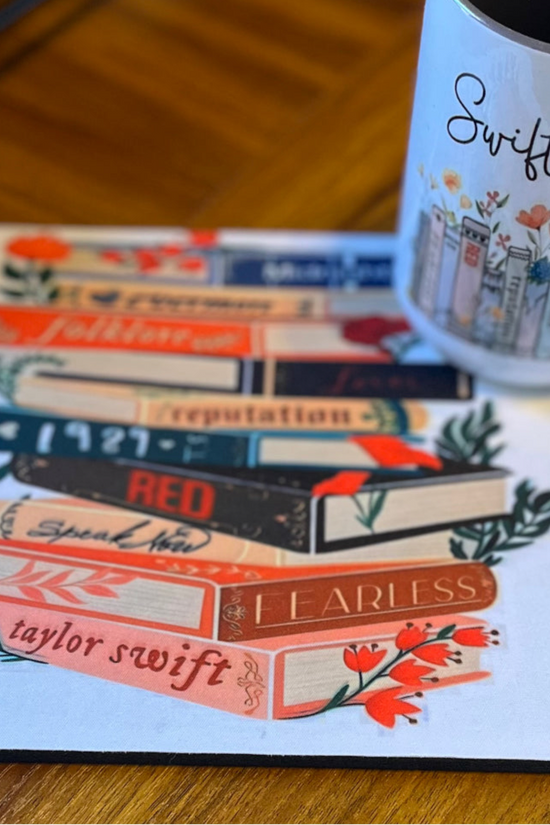 A charming Swiftea Gift Set by Kreative Kreationz sits on a table, featuring a white mug with the word 