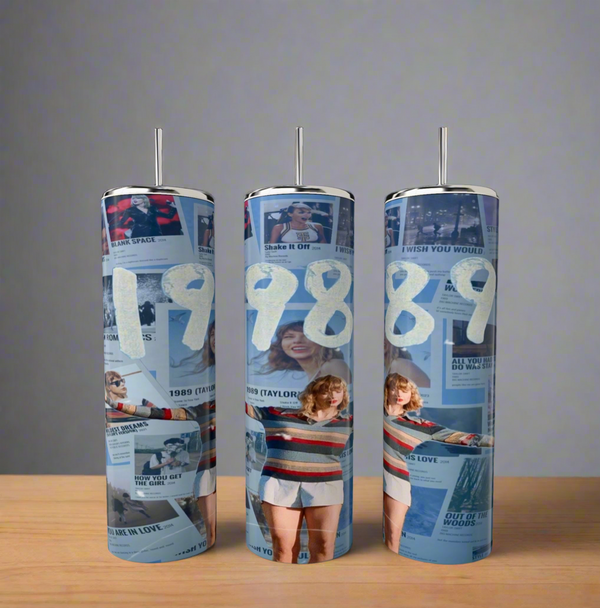 The Kreative Kreationz 1989 Taylor Swift 20oz Tumbler showcases "1989" in bold white numbers with images of a person posing in a striped sweater and white shorts on a neutral gray background. Equipped with a spill-proof lid, it's the ideal companion for any fan.