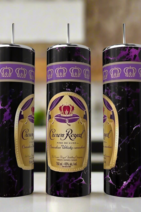 Kreative Kreationz’s Crown 20oz Tumblers feature a Crown Royal whiskey label and purple marble design, complete with straws—eco-friendly drinkware displayed on a kitchen counter, ideal for any occasion.