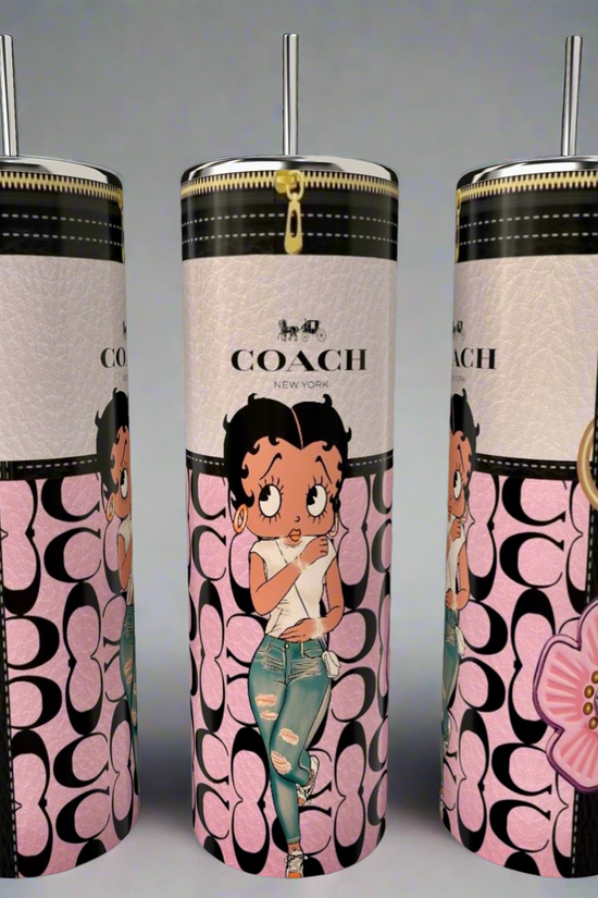 The Kreative Kreationz Betty B 20oz Skinny Tumbler features a floral design, metallic lid and straw, Coach-style pink and black logo, and a cartoon girl in ripped jeans—perfect for eco-friendly sipping in style!.
