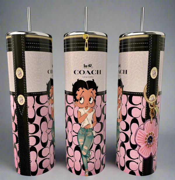 The Kreative Kreationz Betty B 20oz Skinny Tumbler features a floral design, metallic lid and straw, Coach-style pink and black logo, and a cartoon girl in ripped jeans—perfect for eco-friendly sipping in style!.