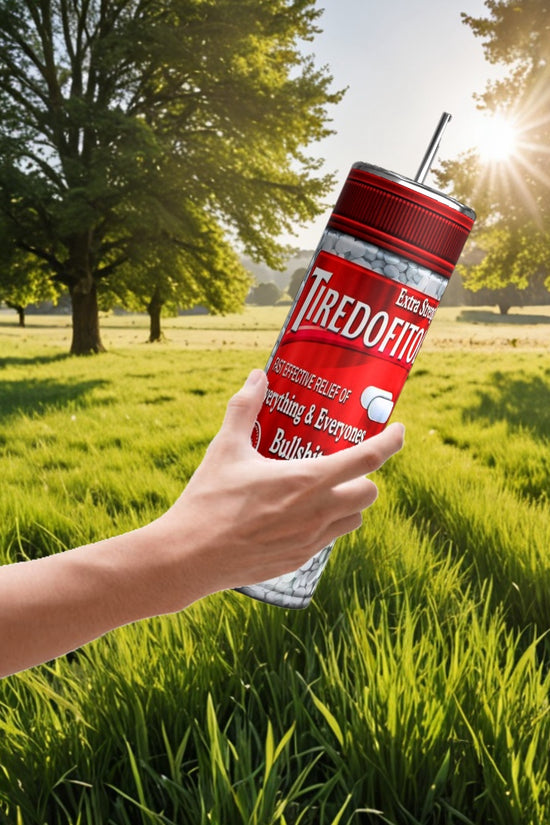 In a serene field with trees, a hand holds a personalized Kreative Kreationz Proceastinex Adult Issues 20oz Skinny Tumbler labeled 
