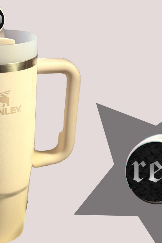 A cream-colored Stanley tumbler with a handle and lid features REP | Taylor Swift Straw Topper by Kreative Kreationz: a silicone round knob labeled 
