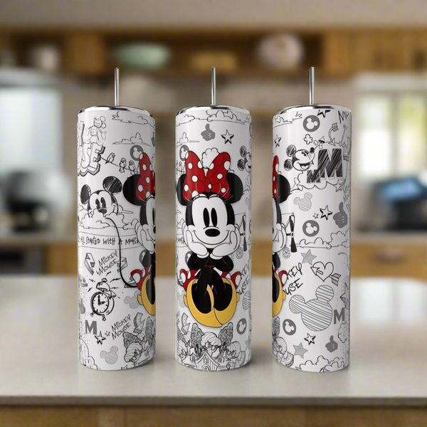 Three 20oz Minnie Mouse Coach Skinny Tumblers by Kreative Kreationz, featuring black, white, and red playful designs, sit on a kitchen counter as eco-friendly drinkware with whimsical charm.