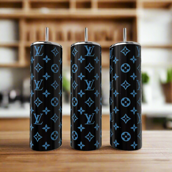 Three LV Inspired Dark Blue 20oz Tumblers by Kreative Kreationz, designed with luxury blue Louis Vuitton logos and floral accents, are displayed side by side on wood with a blurred kitchen background.