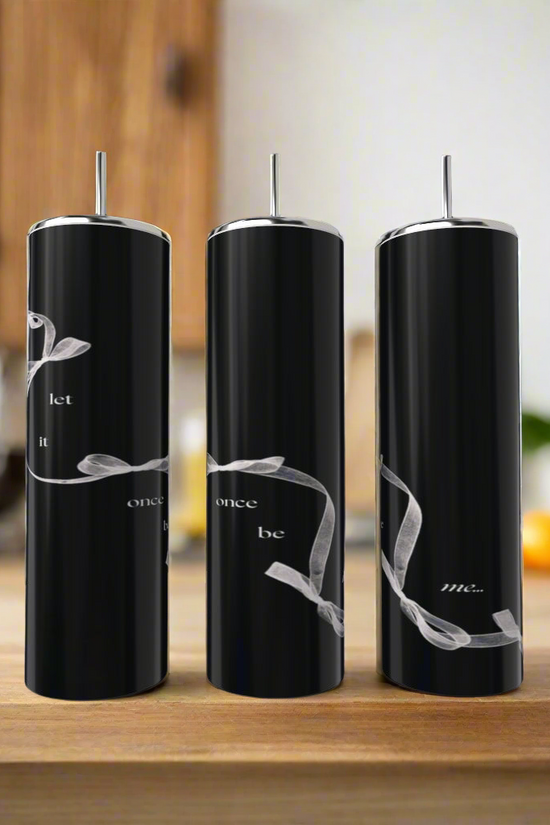 Three Taylor Swift | Let It Once Be Me 20oz tumblers by Kreative Kreationz, each eco-friendly and featuring white script with a silver ribbon, sit on a wooden counter with metal straws against a blurred kitchen backdrop.