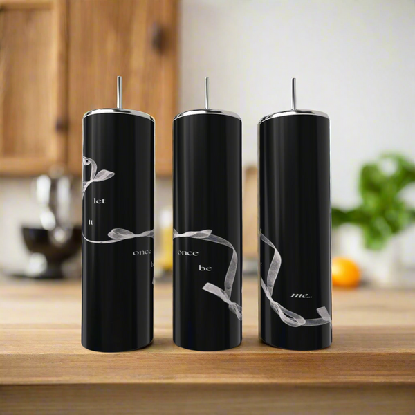Three Taylor Swift | Let It Once Be Me 20oz tumblers by Kreative Kreationz, each eco-friendly and featuring white script with a silver ribbon, sit on a wooden counter with metal straws against a blurred kitchen backdrop.