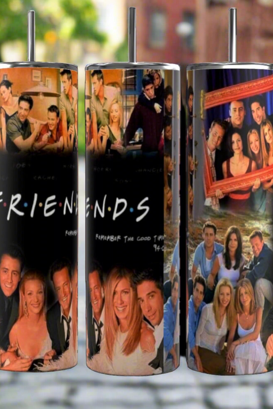 The Friends TV Show Collage 20oz Tumblers by Kreative Kreationz, an ideal gift for any 90s sitcom fan, are showcased on a cobblestone street. Each tumbler features iconic scenes and beloved characters from the show, brought to life with vibrant colors and memorable ensemble moments. Additionally, they are designed with double-wall insulation to ensure your drinks stay at the perfect temperature.