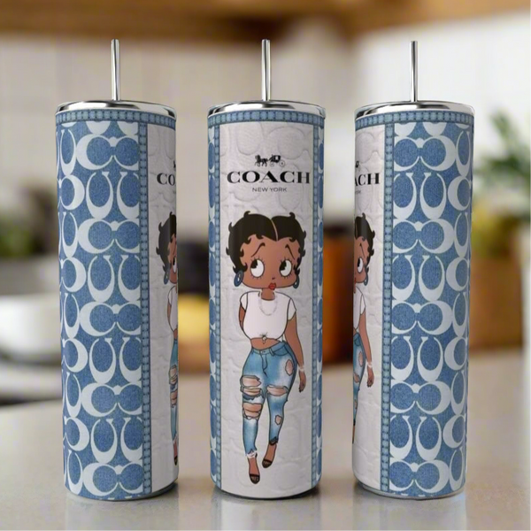 Kreative Kreationz's Betty Boop | Blue 20oz Tumbler features a cartoon woman in a white top and ripped jeans, Coach logo, and blue pattern for a luxury look on your kitchen counter. Includes stainless steel body and silver straw.
