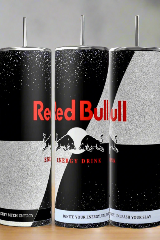 Three tall 20oz Black Edition Tumblers by Kreative Kreationz feature black, white, and gray designs inspired by Red Bull, metal straws, and slogans “Naughty Bitch Energy” & “Ignite Your Energy, Unleash Your Slay.”.