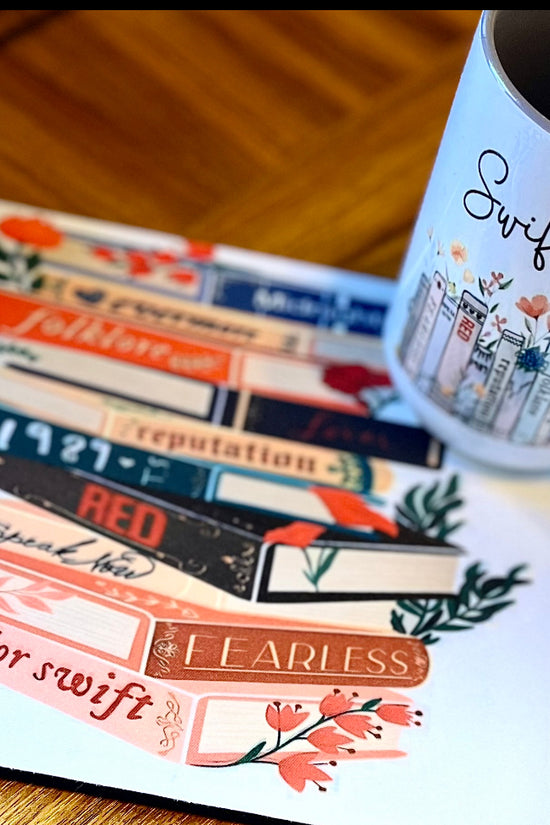 A charming Swiftea Gift Set by Kreative Kreationz sits on a table, featuring a white mug with the word 