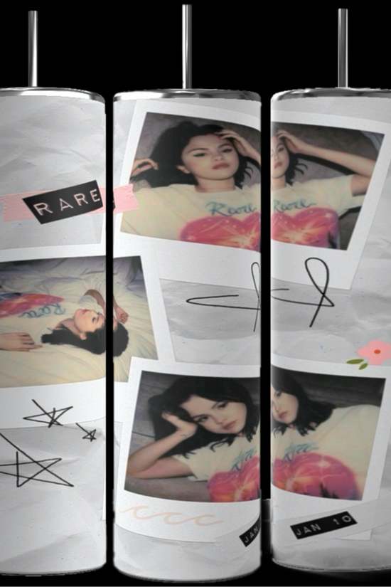 Three tall tumblers are decorated with images of Selena Gomez in different poses; one in a white dress, one with a serious expression, and one in casual attire. The designs, reminiscent of intricate Stanley cups, are embellished with flowers, leaves, hearts, and text like 