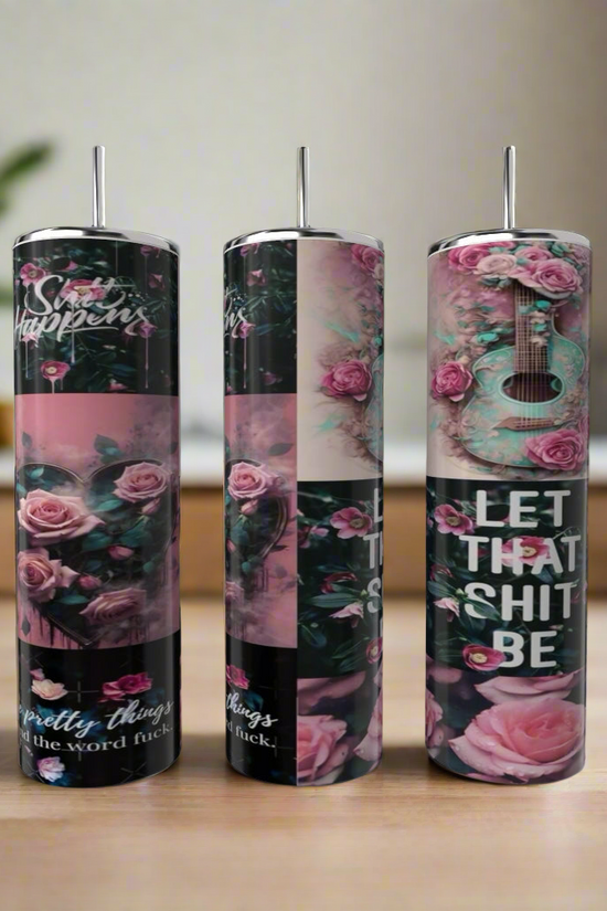 Three eco-friendly, reusable 20oz stainless steel Strong Woman tumblers by Kreative Kreationz feature pink rose and floral designs, bold inspirational phrases, and a luxury-inspired look against a blurred wooden and plant backdrop.
