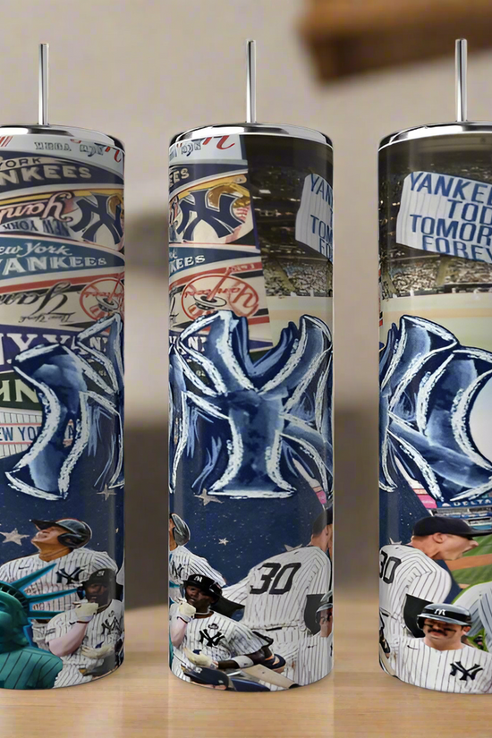 Three Kreative Kreationz New York Yankees 20oz Tumblers, featuring team logos, players, the Statue of Liberty, and bold sublimated designs and slogans, are displayed side by side on a wooden surface.