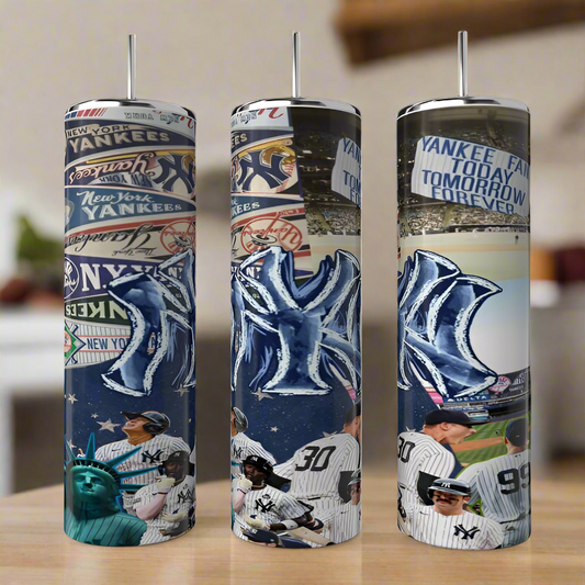 Three Kreative Kreationz New York Yankees 20oz Tumblers, featuring team logos, players, the Statue of Liberty, and bold sublimated designs and slogans, are displayed side by side on a wooden surface.