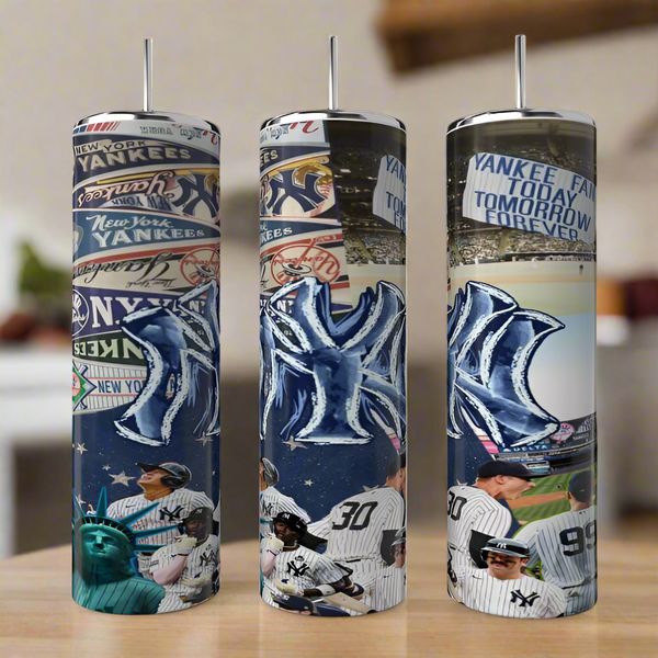 Three Kreative Kreationz New York Yankees 20oz Tumblers, featuring team logos, players, the Statue of Liberty, and bold sublimated designs and slogans, are displayed side by side on a wooden surface.