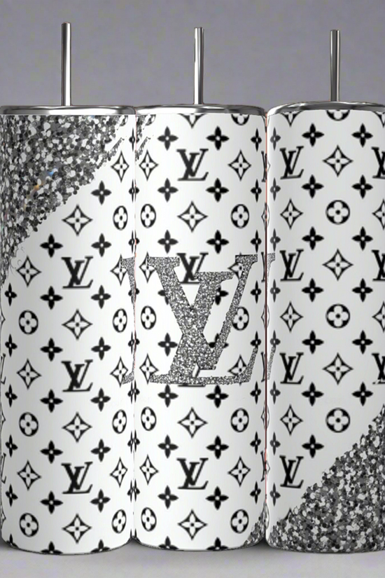 The Kreative Kreationz Louis Vuitton Black & Silver 20oz Tumbler set includes three luxury-inspired tumblers featuring a high-quality stainless steel finish, white background with black patterns, glittery silver accents, and a central tumbler displaying a sparkling logo reminiscent of a Louis Vuitton design.