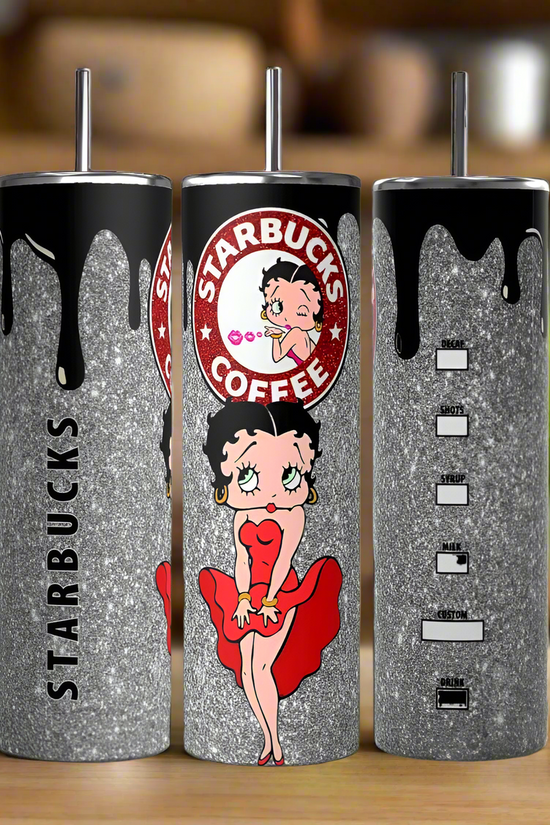 Three glittery silver Betty B Starbucks 20oz Skinny Tumblers by Kreative Kreationz feature black drip designs, a cartoon woman in a red dress, and a spoof coffee logo. These eco-friendly, reusable tumblers stand out against the blurred green and brown backdrop.