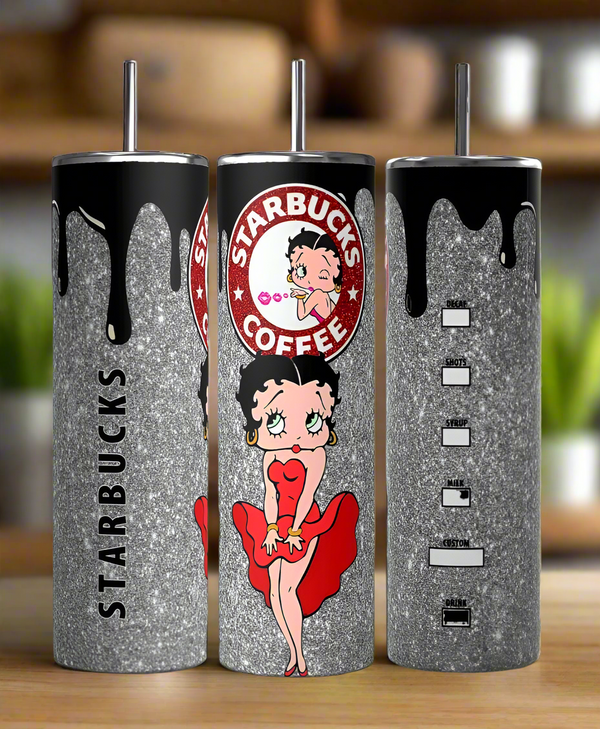 Three glittery silver Betty B Starbucks 20oz Skinny Tumblers by Kreative Kreationz feature black drip designs, a cartoon woman in a red dress, and a spoof coffee logo. These eco-friendly, reusable tumblers stand out against the blurred green and brown backdrop.