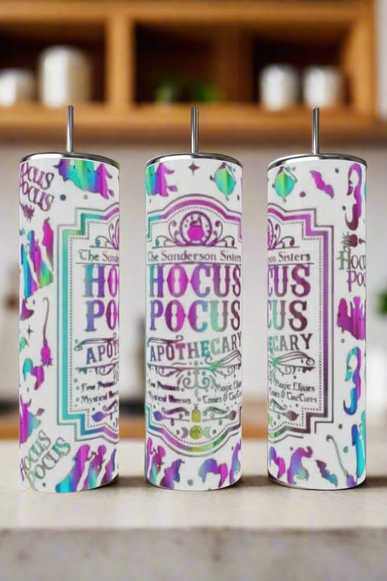 Three vibrant Kreative Kreationz Hocus Pocus 20oz Tumblers with straws sit on a kitchen counter. Adorned with 