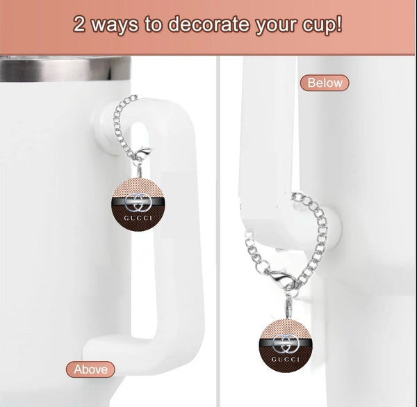 A promotional image features a white cup with a chain and circular Gucci Cup Charm from Kreative Kreationz on its handle. The text reads, "2 ways to decorate your cup!" highlighting options to position the tumbler charm above or below the handle.