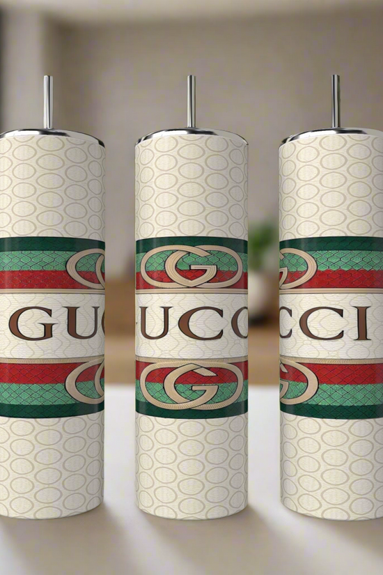 A set of three 20oz Gucci tumblers by Kreative Kreationz, each crafted from eco-friendly reusable materials, showcase a patterned design with bold logos and horizontal green and red stripes featuring the interlocking 