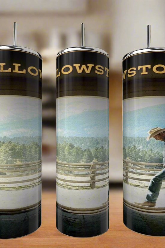 Three Kreative Kreationz John Dutton Yellowstone 20oz Tumblers with straws, each showcasing a cowboy and mountain design, are arranged on a kitchen counter.