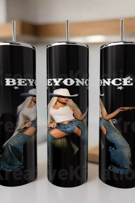 The Beyonce 20oz Stainless Steel Tumblers by Kreative Kreationz feature Beyoncé in a white hat, top, and jeans with “BEYONCÉ” above her. These eco-friendly tumblers come with silver straws and add style to any kitchen counter.