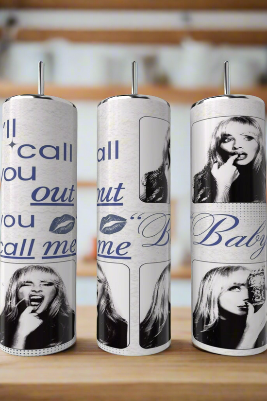 The Kreative Kreationz “I’ll call you out | Sabrina Carpenter 20oz Tumbler” is displayed next to three vertical paper towel rolls with blue and black pop art, featuring a woman's face and phrases like 
