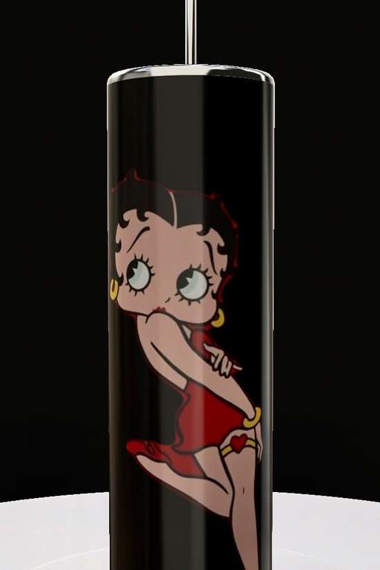 The Betty B White 20oz Skinny Tumbler by Kreative Kreationz features a playful cartoon woman in a red dress and hoop earrings against a black background, complete with a metallic straw. Ideal for fans of fun and style.
