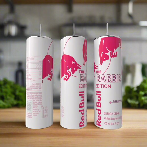 A Barbie Edition 20oz Tumbler by Kreative Kreationz sits on a wooden kitchen surface, featuring playful pink branding reminiscent of Barbie style, similar to the design found on Red Bull's Barbie Edition cans.
