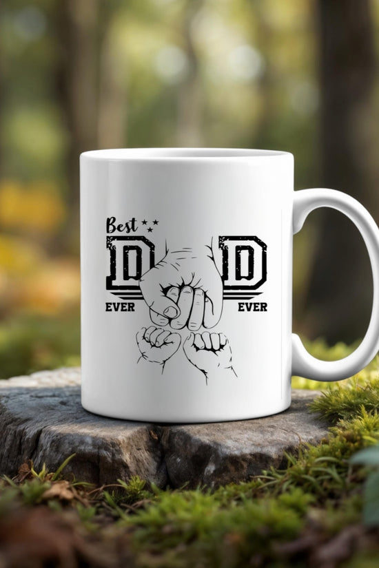 The Dad Best Ever Ceramic Mug by Kreative Kreationz, featuring two fists bumping and 