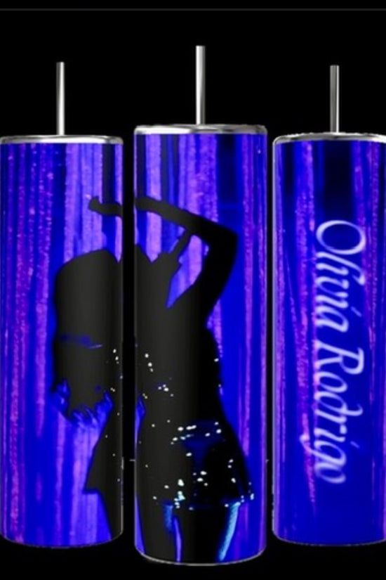 Image showing three tall, cylindrical Olivia Rodrigo 20oz Tumblers by Kreative Kreationz, each equipped with a metal straw. The tumblers feature a blue background with a silhouette of a dancing figure on two of them and the name 