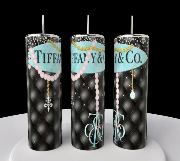 Three tall Kreative Kreationz Tiffany 20oz Tumblers with black quilted patterns, blue "Tiffany & Co." logos, pink pearl necklaces, gold chains, and stainless steel straws are displayed on a white surface against a black background.
