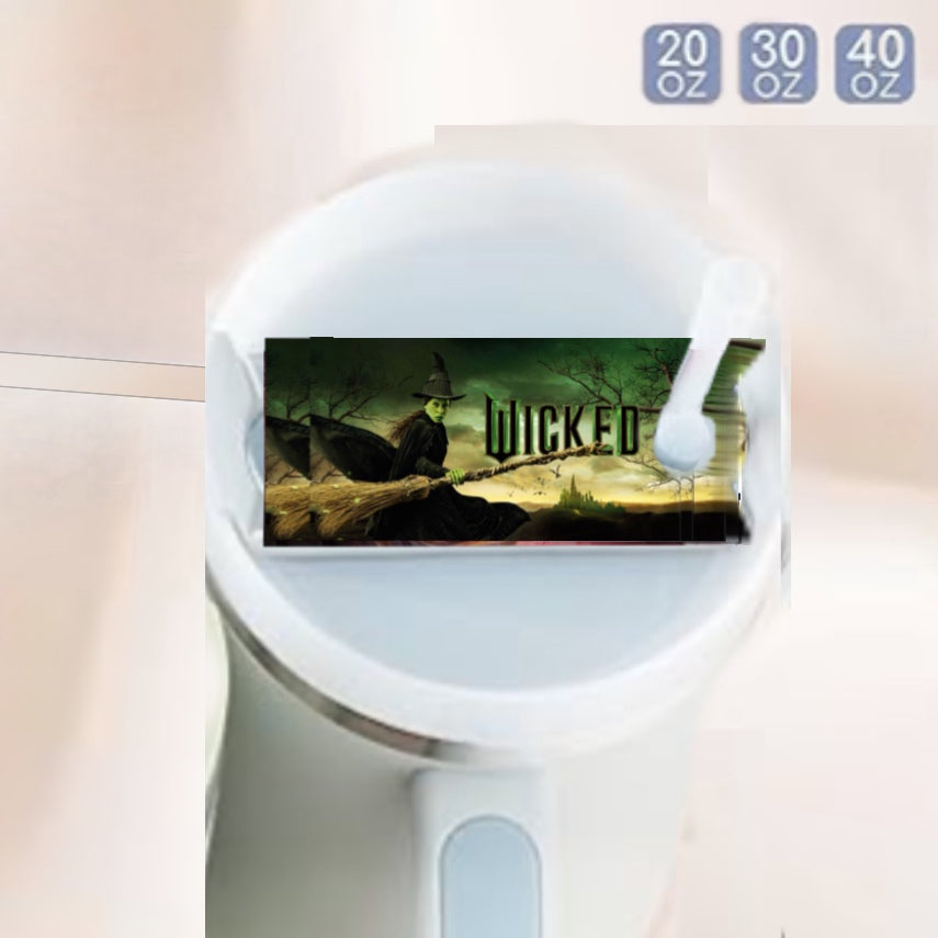 The Witch Stanley Lid Topper by Kreative Kreationz is a sublimated cylindrical mug with a handle, featuring a digital witch-on-broomstick label and "WICKED" text. It offers 20 oz, 30 oz, and 40 oz capacity options displayed in gray boxes at the top right corner.