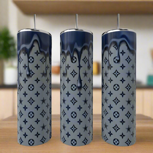 Three Dallas Cowboys LV Drip 20oz Tumblers by Kreative Kreationz stand on a wooden surface. Each stainless steel tumbler features a gray base, dark blue drip design, and repeating star and floral patterns. A kitchen is blurred in the background.
