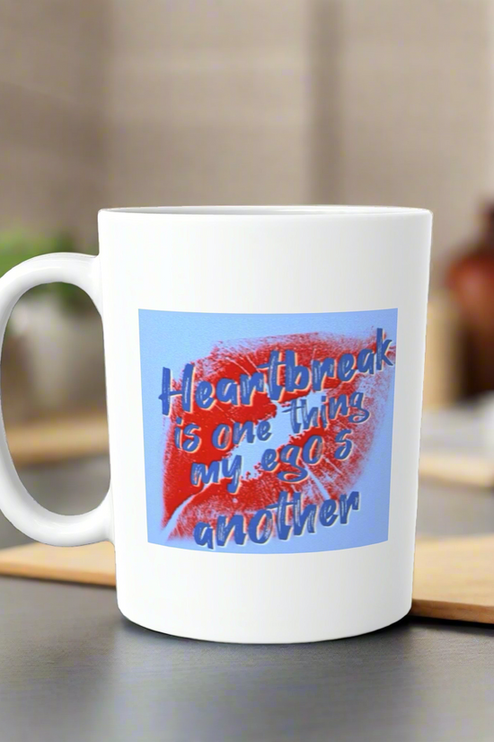 The Sabrina Carpenter Ceramic Lips Mug by Kreative Kreationz sits on a kitchen counter, showing red lipstick marks and the quote, 