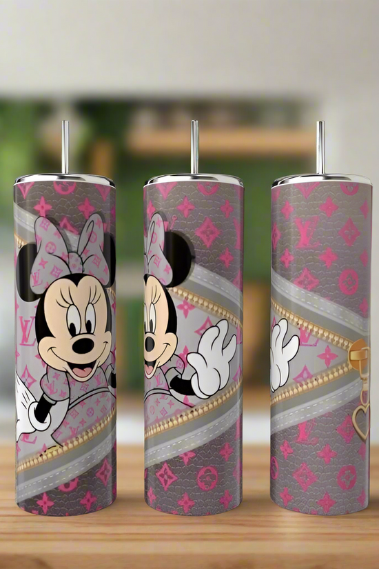 Three 20oz stainless steel tumblers from Kreative Kreationz's Mickey Mouse LV Peek-a-Boo Collection, featuring Minnie Mouse with pink bows, chic gray and pink backgrounds, and faux gold zippers on a wooden surface with a blurred kitchen backdrop.
