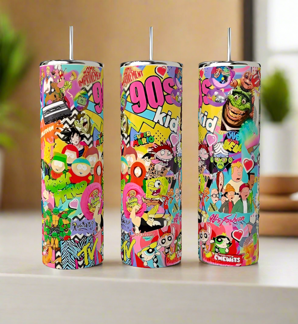 Three Kreative Kreationz "I Love The 90’s" 20oz tumblers, decorated with nostalgic 90s cartoon art and bold “90s kid” text, stand on a table, highlighting their retro-inspired design and pop culture graphics.