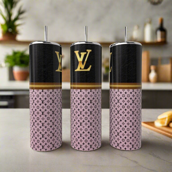 Three Kreative Kreationz LV Zipper 20oz Tumblers with metal straws, each showcasing a chic black and pink Louis Vuitton-inspired pattern with LV logo, sit on a counter against a blurred kitchen background.
