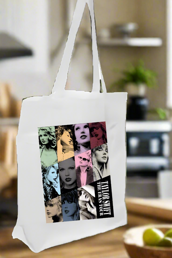 In the kitchen, the Eras Tote Bag by Kreative Kreationz stands out with its pop art collage of a woman. This white canvas bag is ideal for Swifties and pairs perfectly with limes on the countertop and lush plants.
