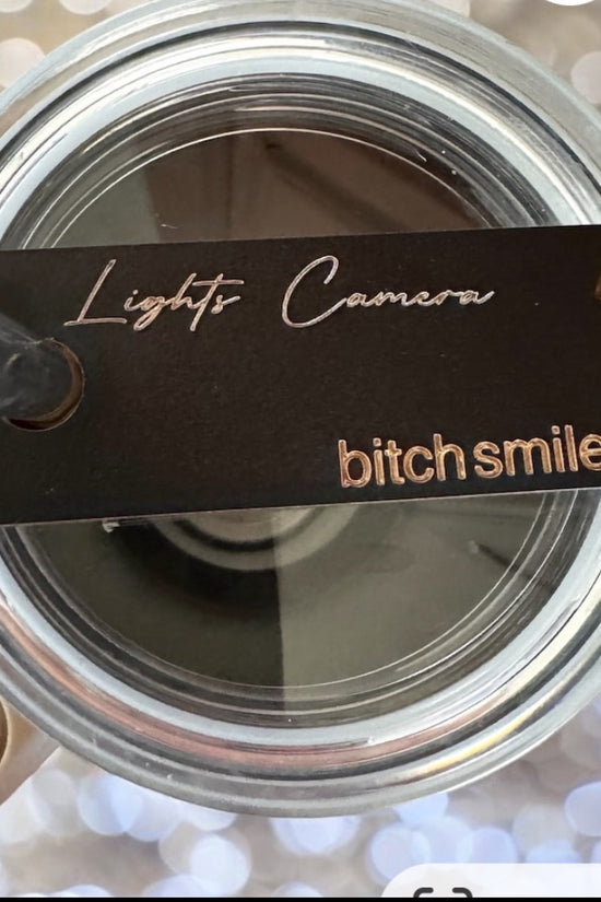 A close-up of an open cosmetic compact with a mirror resembles Kreative Kreationz's 