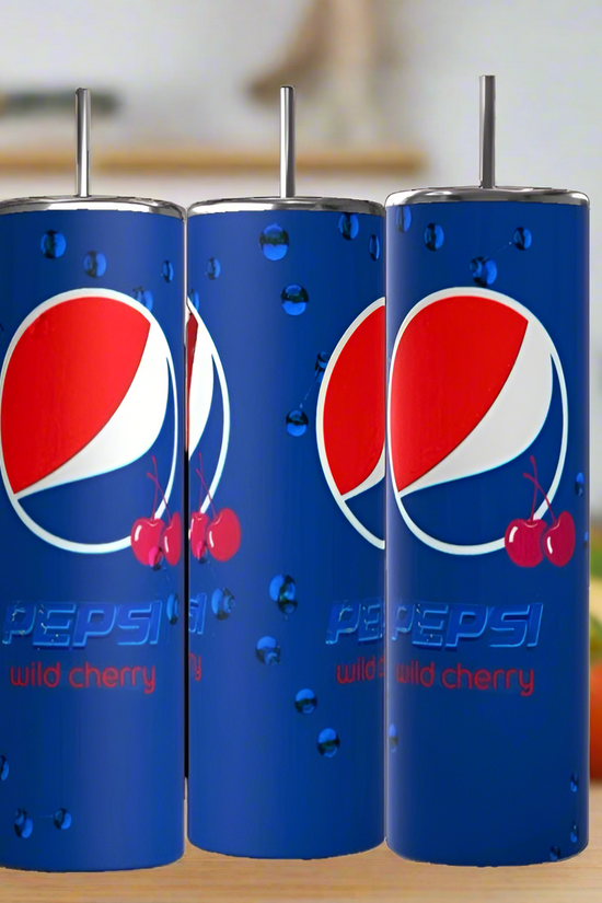 Kreative Kreationz Cherry Pepsi 20oz Tumblers, made from eco-friendly stainless steel, feature Wild Cherry logos, water droplets, and cherry art on blue. The three tall tumblers stand against a blurred kitchen background.