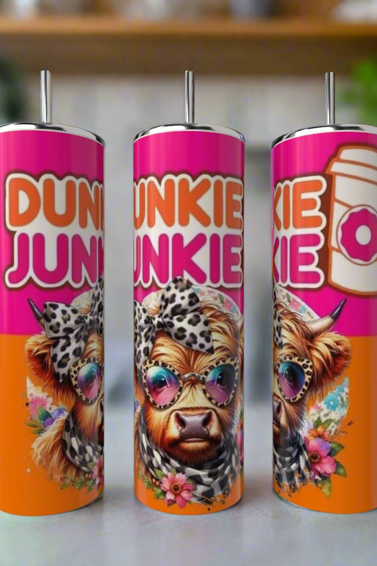 The Kreative Kreationz Dunkin Junkie Cow 20oz Tumbler features a cartoon cow in sunglasses with a leopard-print headband, flowers, and bold 