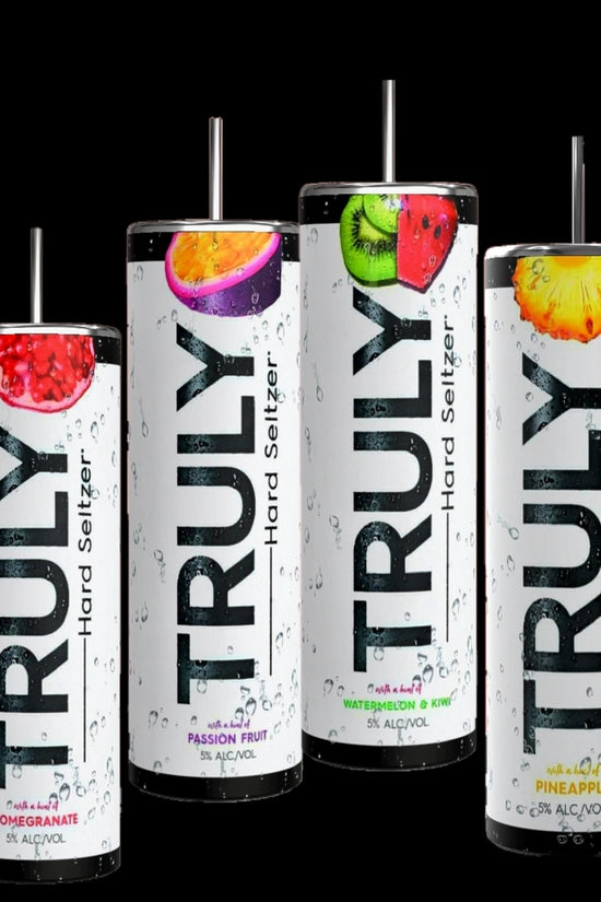 Four Truly Tumbler cans by Kreative Kreationz stand out against a black background, each showcasing 3D fruit designs of pomegranate, passion fruit, pineapple, and watermelon kiwi. Their sleek design mirrors the elegance of a Ciroc-inspired stainless steel tumbler.