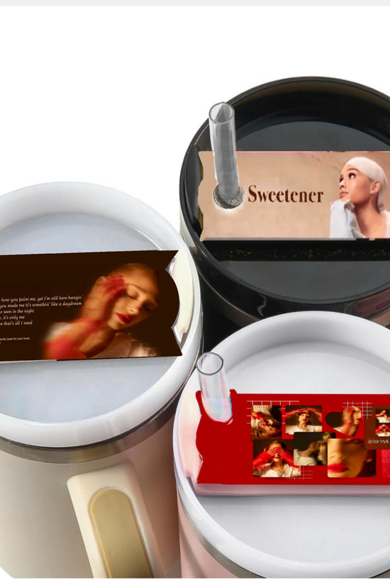 Three cylindrical containers are topped with images resembling Kreative Kreationz's Ariana Grande Stanley lid Plate/Toppers. The top container has an image labeled 