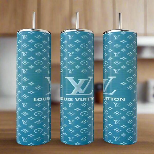 Three Teal LV 20oz Tumblers by Kreative Kreationz, each tall and cylindrical with straws, feature a teal background and white Louis Vuitton-inspired patterns, displayed on a wooden surface with a blurred kitchen backdrop.