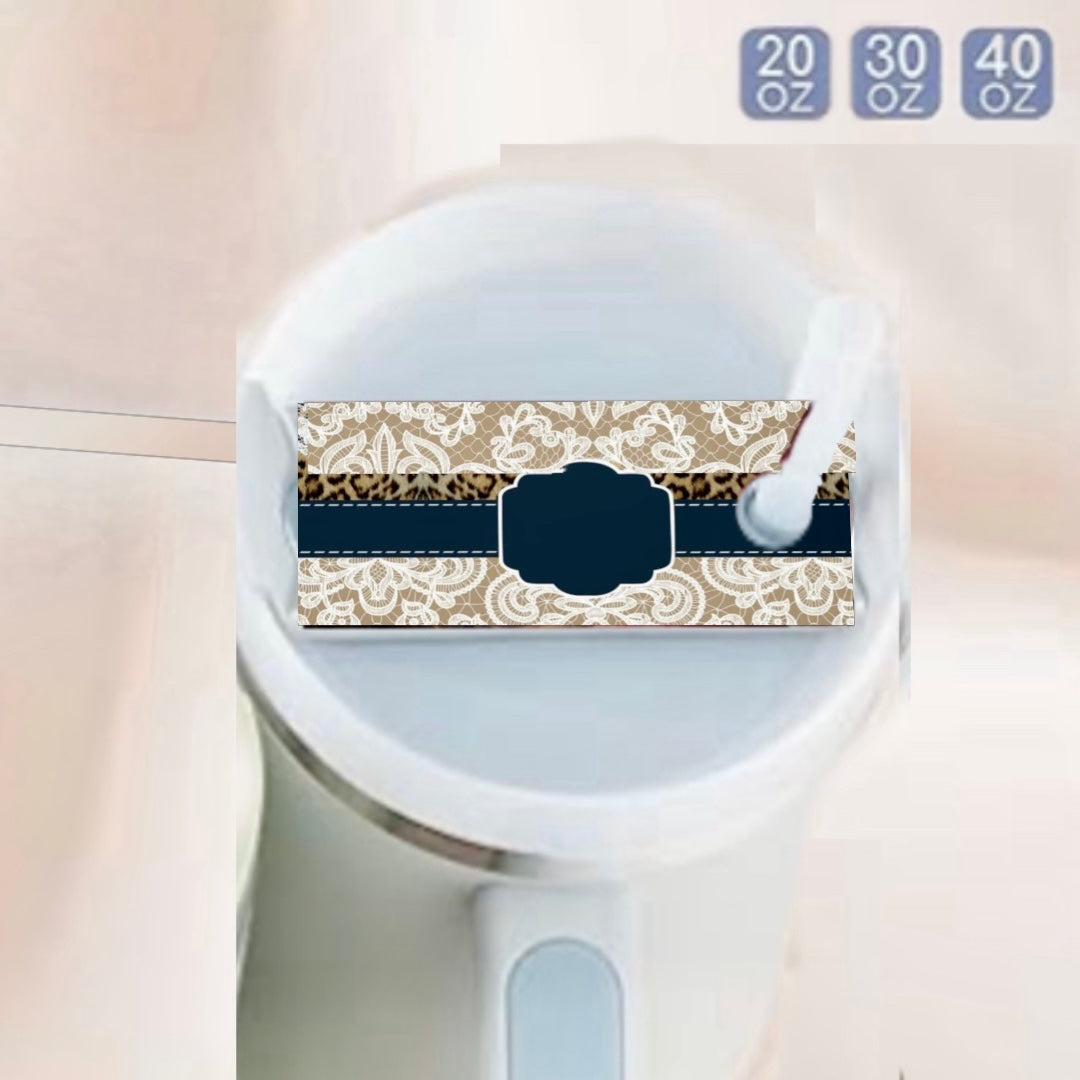 A close-up of a white tumbler with handle, featuring a blank ornate label for the Custom Lace Stanley Lid Plate/Topper by Kreative Kreationz and a white straw. Sizes—20 oz, 30 oz, 40 oz—are displayed in the top right corner.